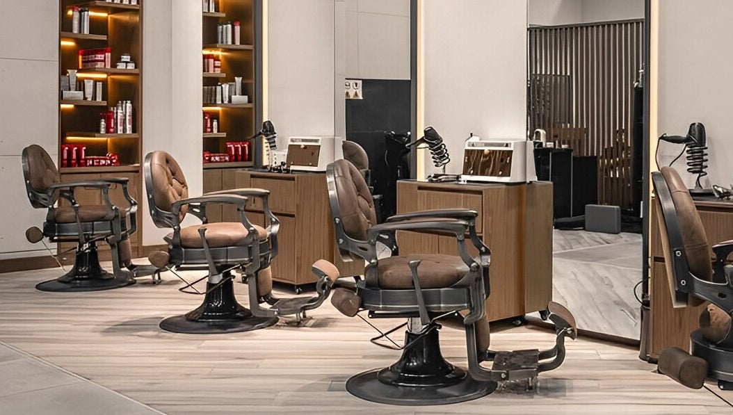 Elegant salon chairs in Scissors & Razors, Dubai, AE offer a stylish and comfortable setting for clients.