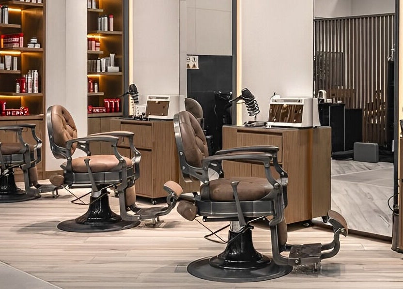Elegant salon chairs in Scissors & Razors, Dubai, AE offer a stylish and comfortable setting for clients.