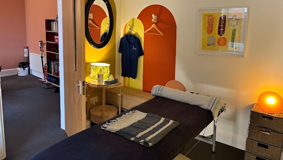 Relaxing massage room at Shep Sports Massage, London, England, GB, featuring modern decor and soothing lighting.