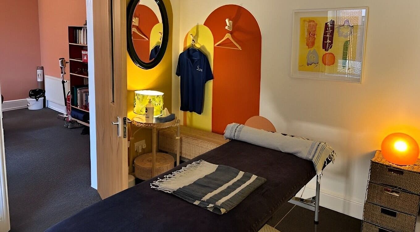Relaxing massage room at Shep Sports Massage, London, England, GB, featuring modern decor and soothing lighting.