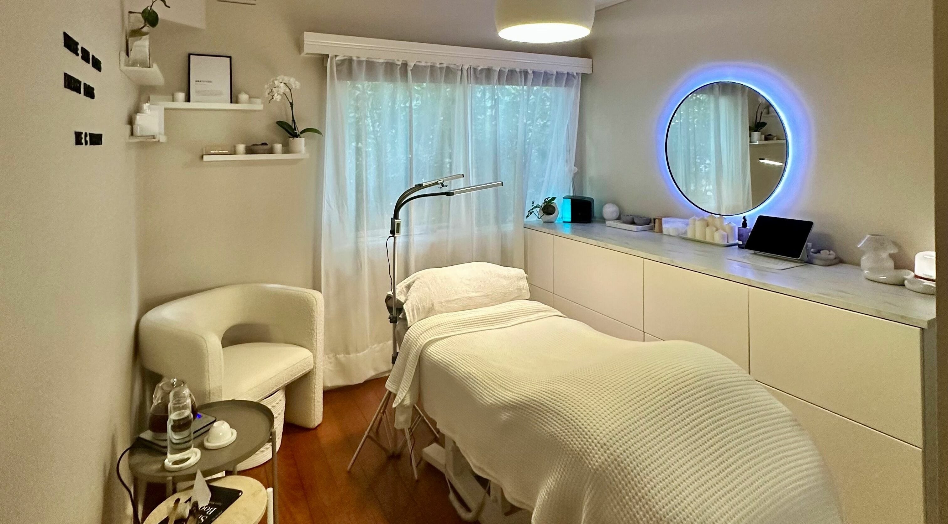 Relaxing therapy room at The C Therapy in Melbourne, Victoria, AU with a plush bed and serene decor.