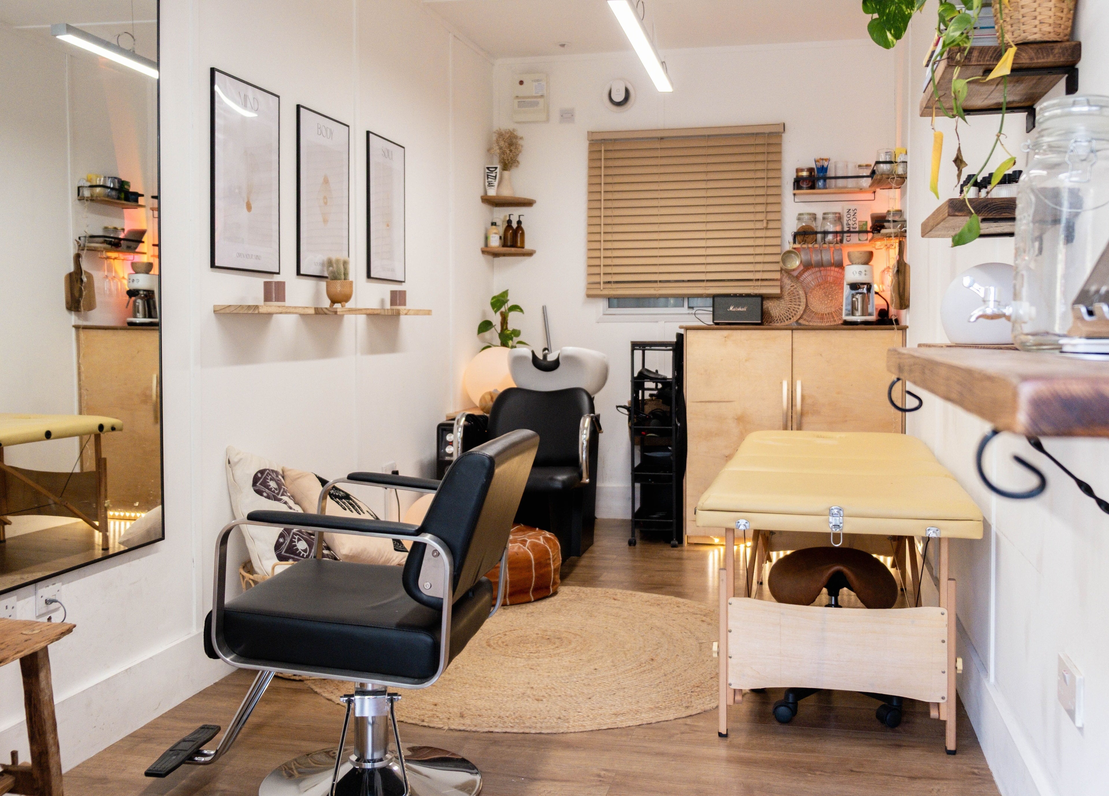 Elegant beauty room at Leia Loves, London, England, GB, showcasing a modern chair and massage table.