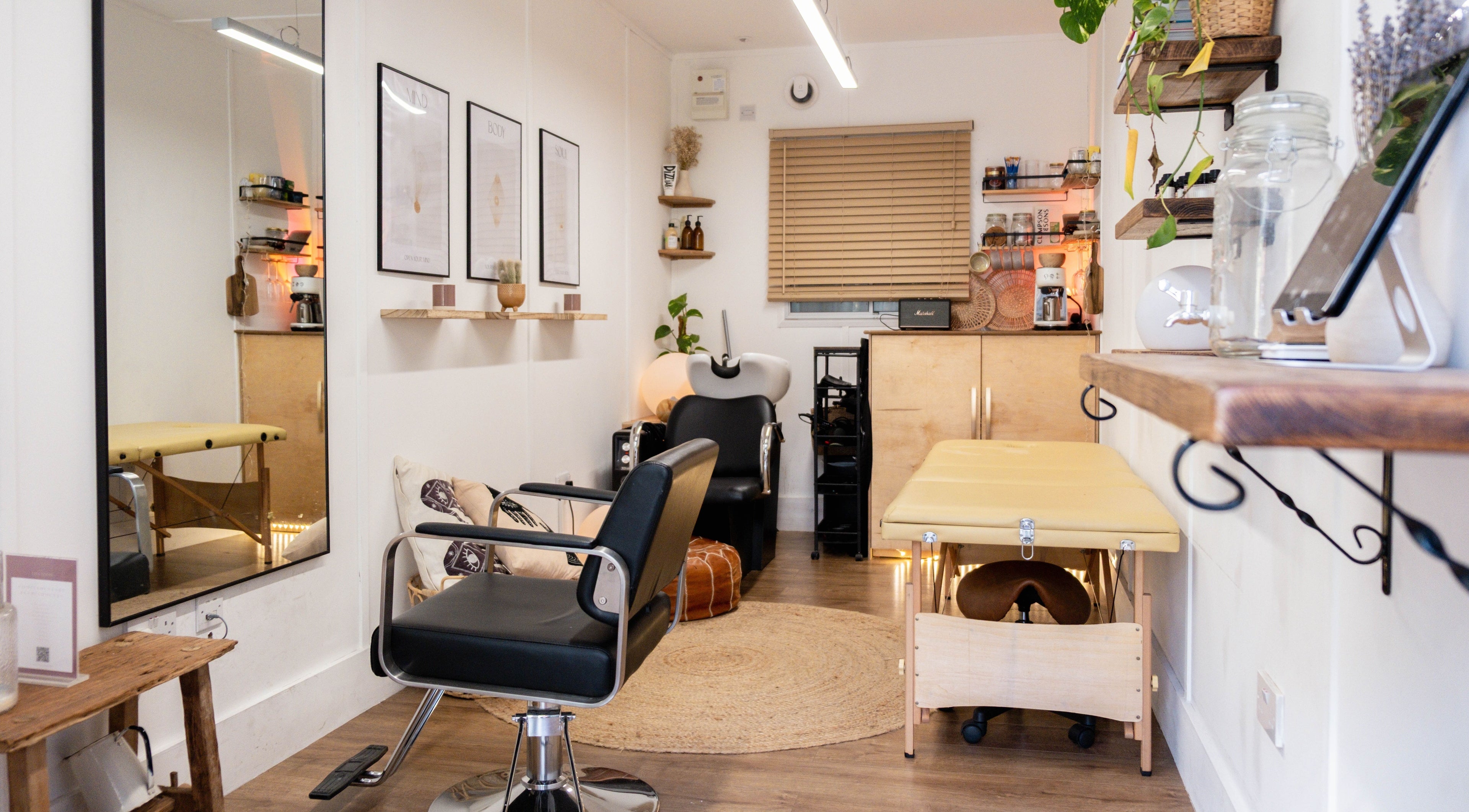Elegant beauty room at Leia Loves, London, England, GB, showcasing a modern chair and massage table.