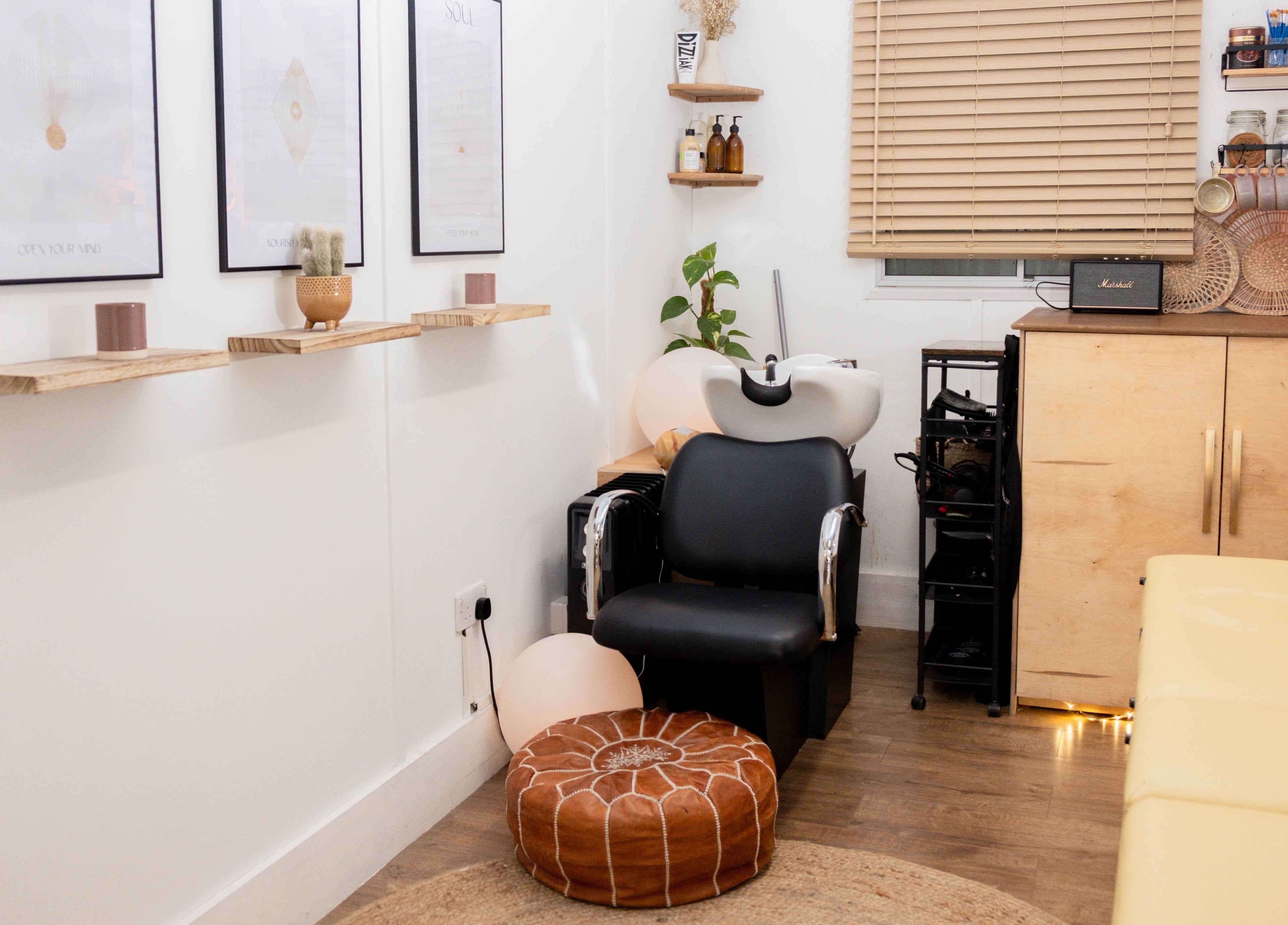 Chic salon corner at Leia Loves, London, England, GB, featuring a modern chair and elegant decor.