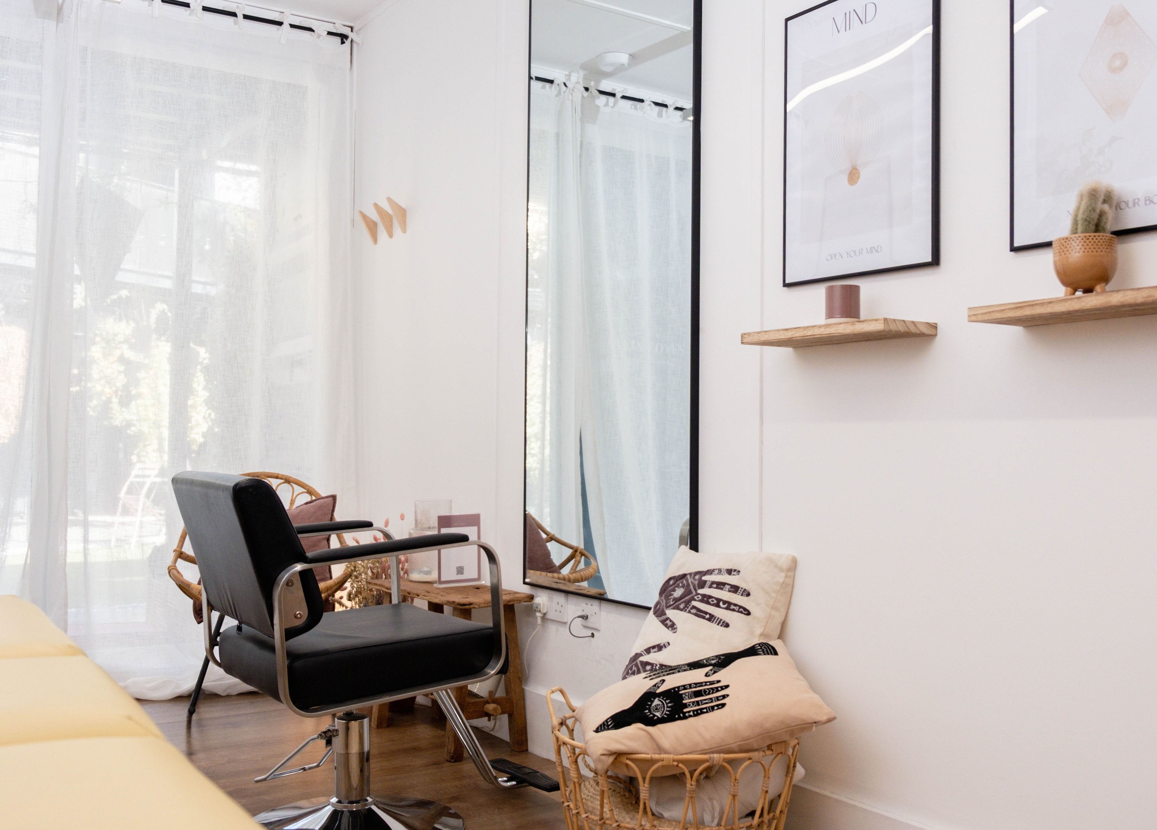 Relaxing salon interior at Leia Loves, London, England, GB with chic decor and comfortable seating.