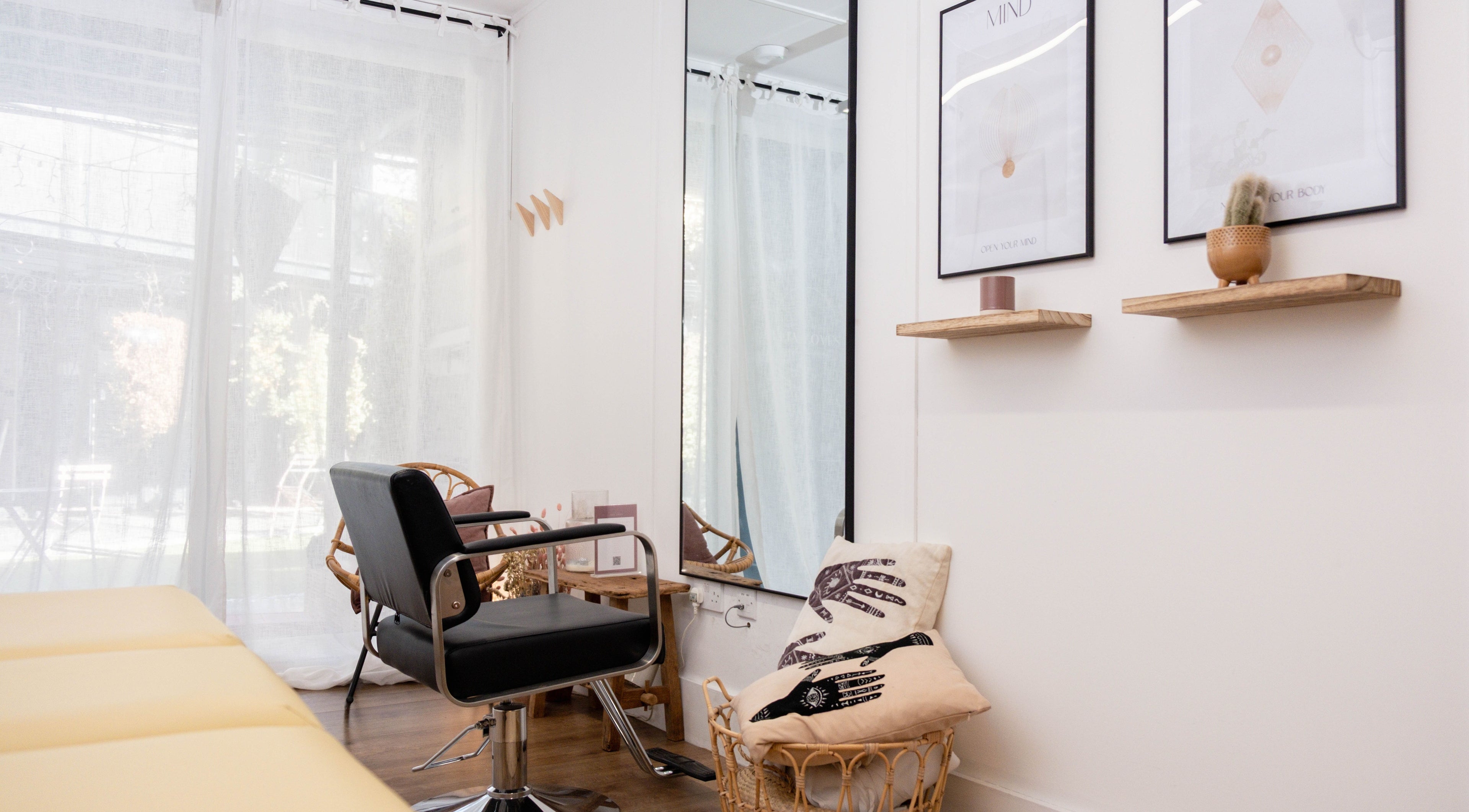 Relaxing salon interior at Leia Loves, London, England, GB with chic decor and comfortable seating.