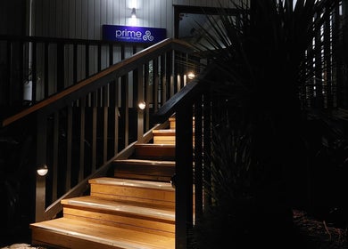 Illuminated stairs at night leading to Prime Massage Therapy (West Auckland), Auckland, Auckland, NZ.