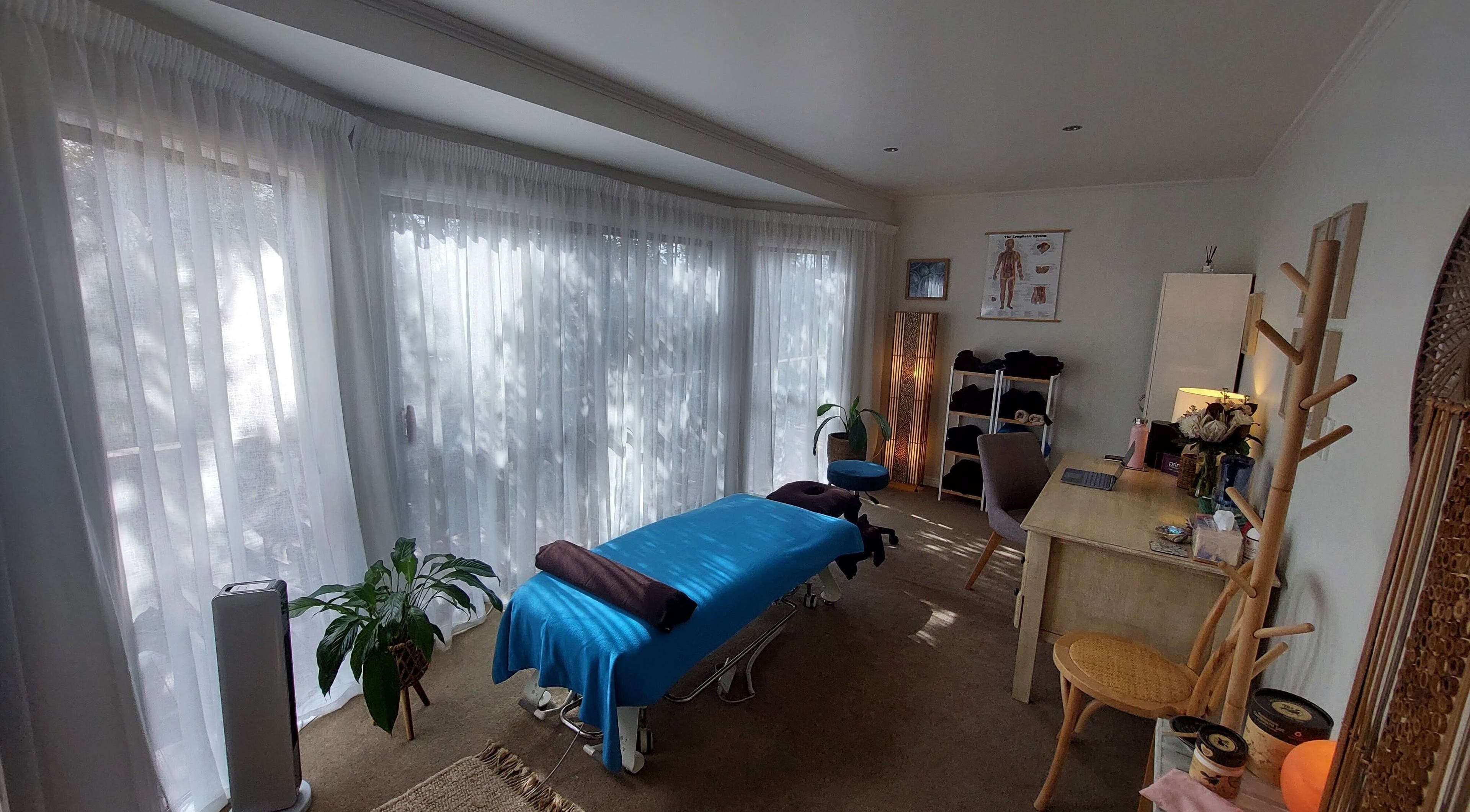 Peaceful massage room at Prime Massage Therapy (West Auckland), Auckland, NZ featuring a cozy setup with natural light.