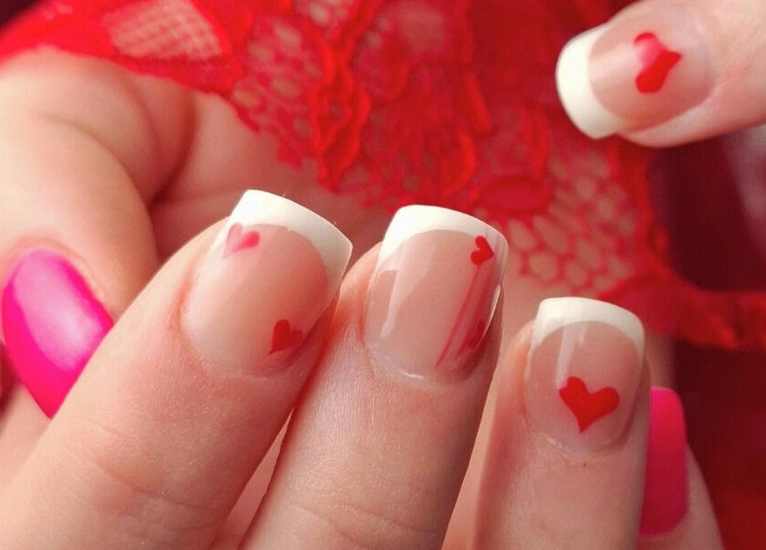 Stylish French manicure with red heart design at Starry Moon Beauty Swords, County Dublin, IE.