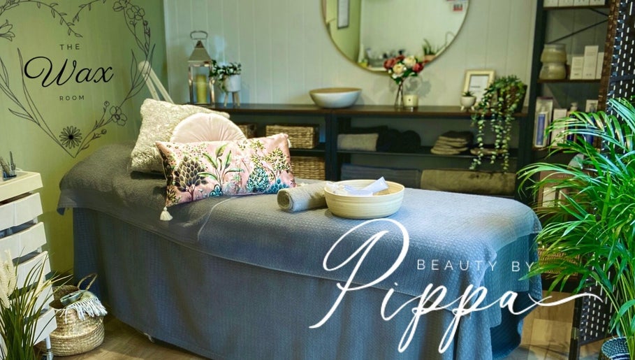 Relaxing treatment room at Pippa Hutchison Beauty & Training in Burton upon Trent, England, GB with floral decor.