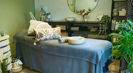 Calming spa room at Beauty by Pippa in Burton upon Trent, England, GB with a plush massage table and elegant decor.