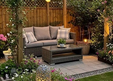 Relaxing garden seating at Beauty by Pippa, Burton upon Trent, England, GB, surrounded by lush flowers.
