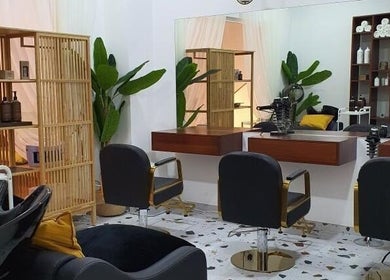 Interior of Shamsa Beauty Salon in Sharjah, AE showing stylish chairs and modern decor.