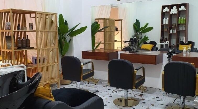 Interior of Shamsa Beauty Salon in Sharjah, AE showing stylish chairs and modern decor.
