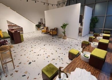 Chic interior of Shamsa Beauty Salon in Sharjah, AE, features modern decor, lush seating, and spa amenities.