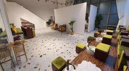 Chic interior of Shamsa Beauty Salon in Sharjah, AE, features modern decor, lush seating, and spa amenities.