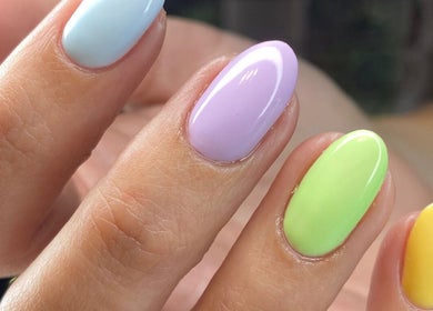 Vibrant pastel nail art at Mari-cles, Pretoria, Gauteng, ZA, showcasing expert manicure services.