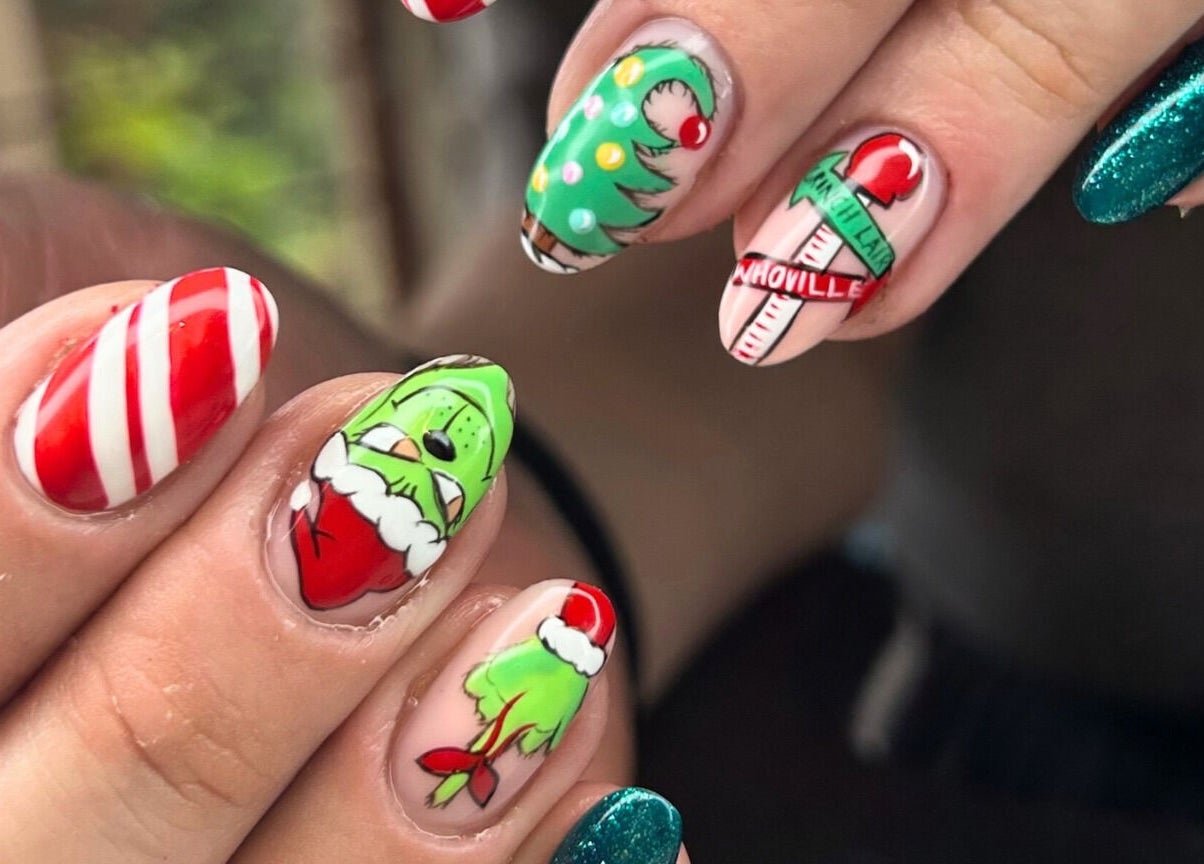 Christmas-themed nail art design at Mari-cles, Pretoria, Gauteng, ZA with candy cane and holiday motifs.