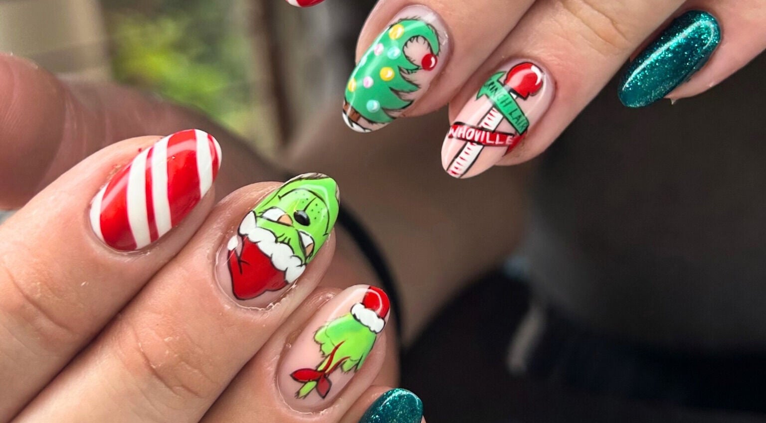 Christmas-themed nail art design at Mari-cles, Pretoria, Gauteng, ZA with candy cane and holiday motifs.