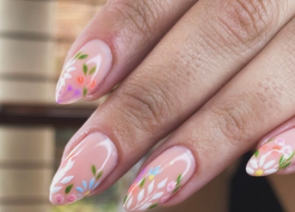 Elegant floral nail art at Mari-cles in Pretoria, Gauteng, ZA, showcasing intricate detail and vibrant colors.