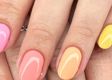 Colorful manicured nails at Mari-cles, Pretoria, Gauteng, ZA. Pastel shades create a vibrant look.