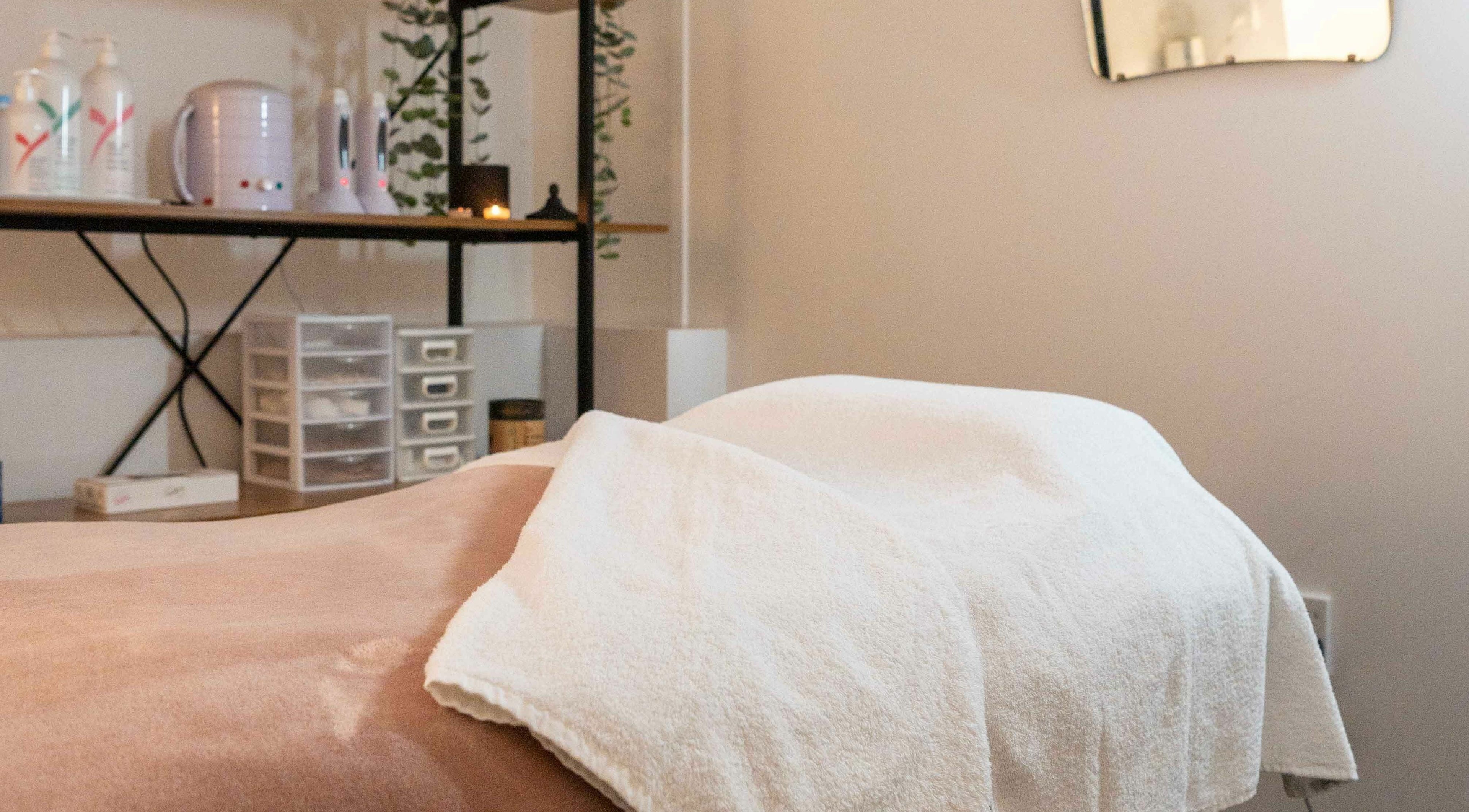 Relaxing massage room at Foxé, Taranaki, Taranaki, NZ with warm lighting and cozy setup.