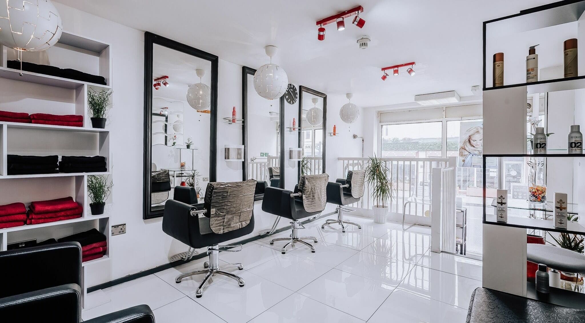 Chic salon interior at Beauty Pac - Tan and Hair Salon, London, England, GB, with modern styling chairs and decor.