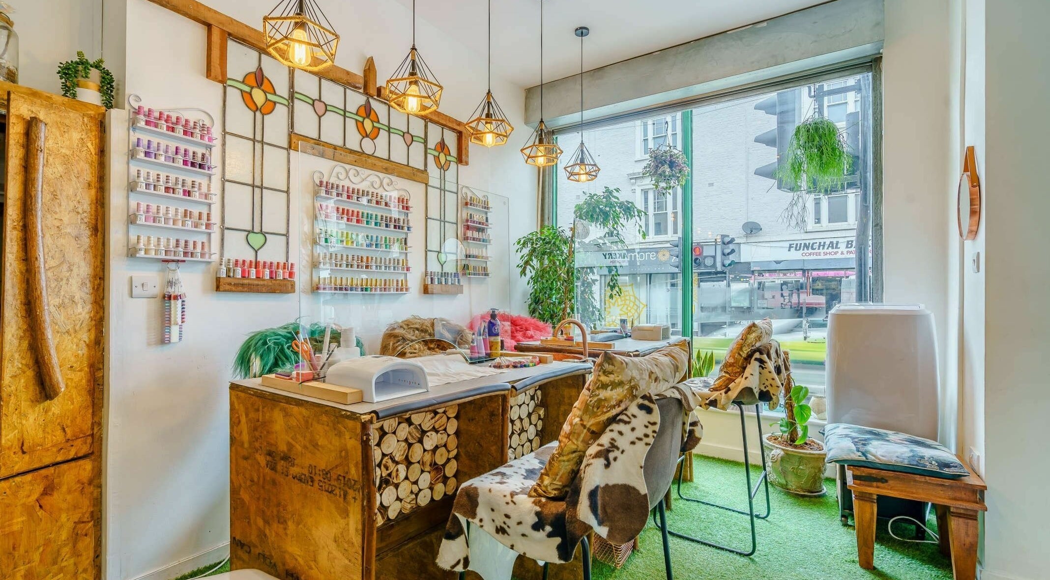 Charming BeautyPac Brixton interior with nail polish wall and rustic decor in London, England, GB.