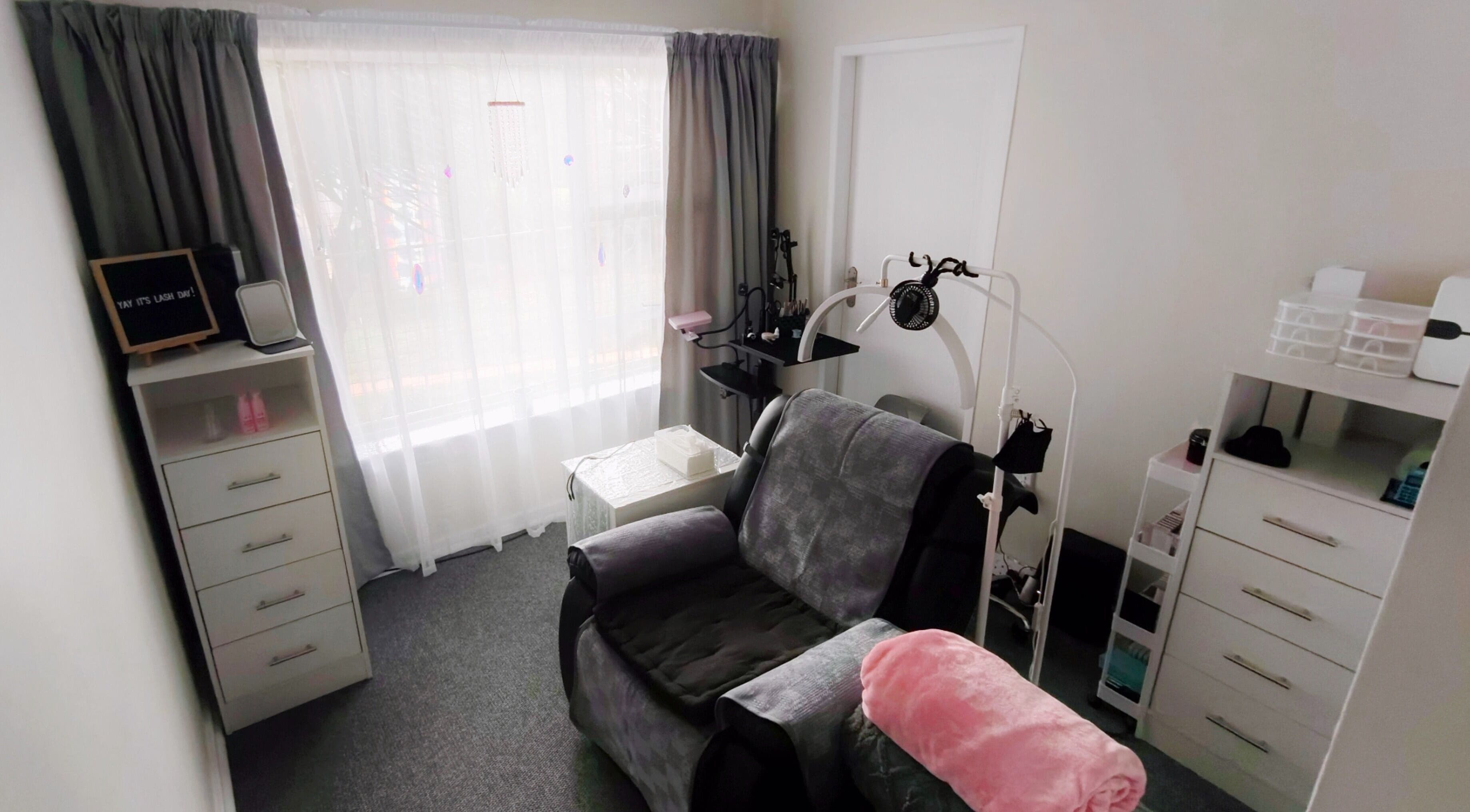 Cozy lash treatment room at Lashes by Jodene, Kempton Park, Gauteng, ZA, featuring a plush chair and calming decor.