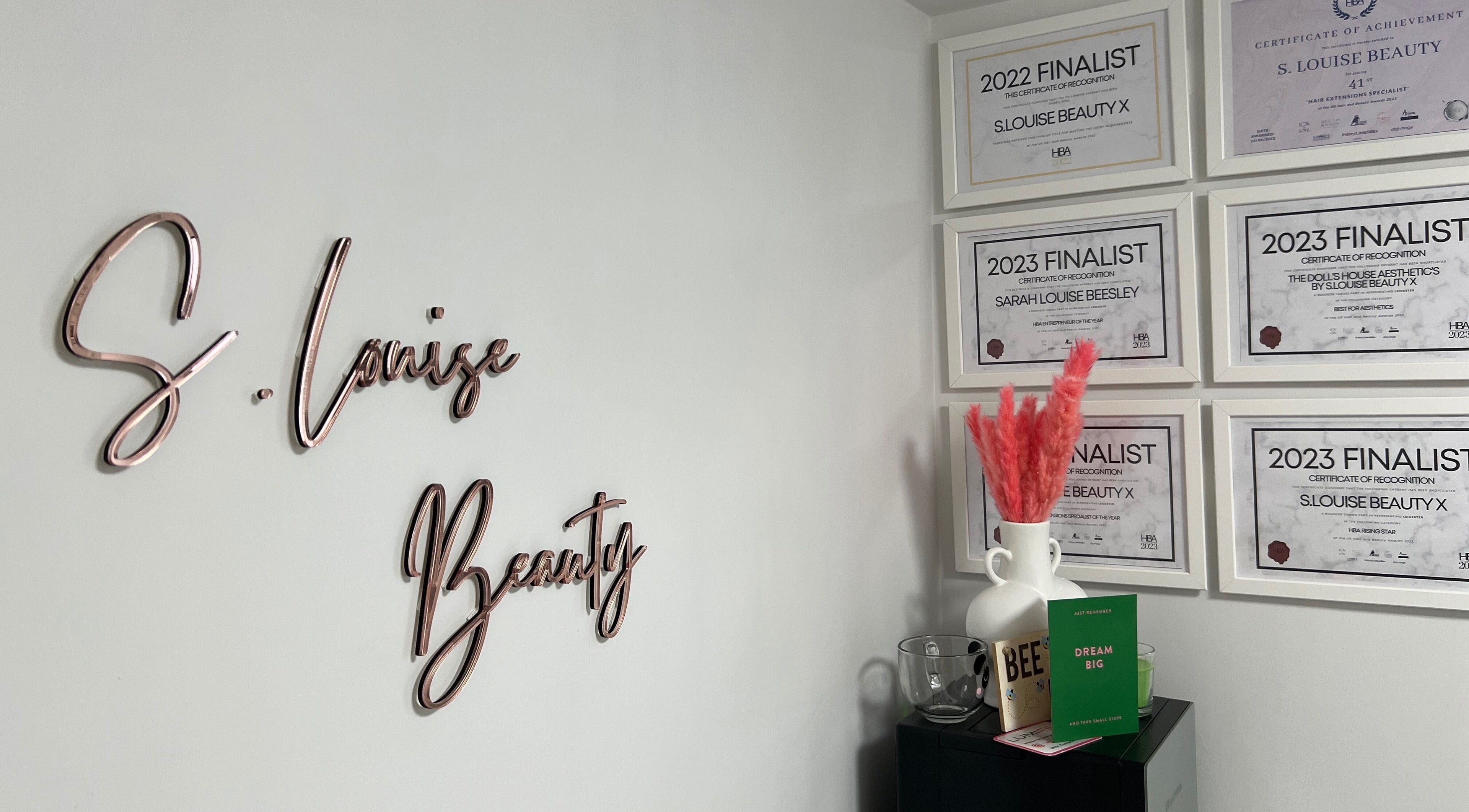 Awards wall at S.Louise Beauty X, Markfield, England, GB, showcasing notable achievements in beauty services.