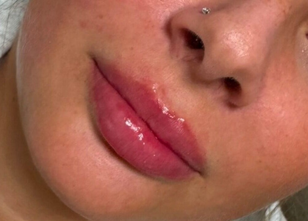 Close-up of glossy lips at S.Louise Beauty X in Markfield, England, GB highlighting vibrant care.