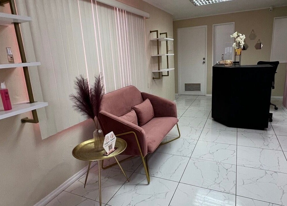 Modern reception at Ethereal Beauty, Willemstad, Curaçao with blush seating and chic decor.