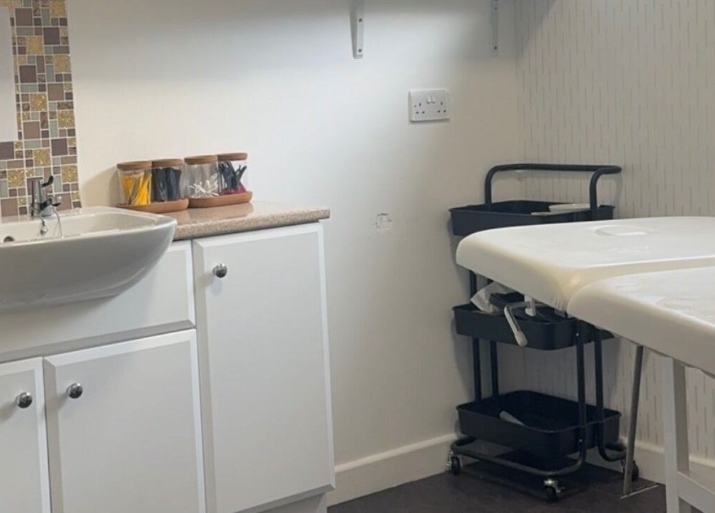 Treatment room at Divine Beauty at Seafield Salon, Inverness, Scotland, GB, featuring a sink and massage table.