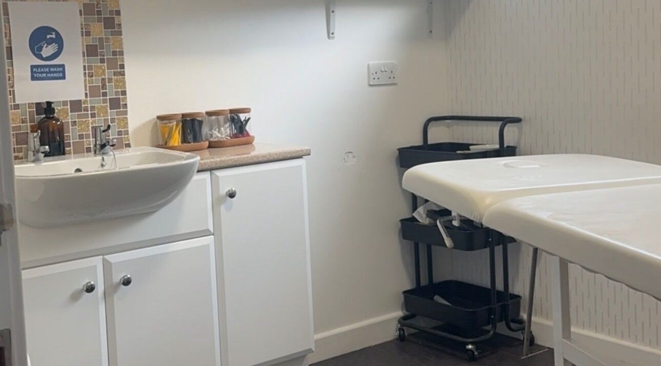 Treatment room at Divine Beauty at Seafield Salon, Inverness, Scotland, GB, featuring a sink and massage table.