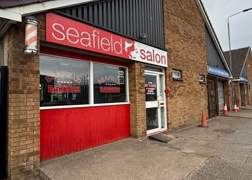 Front view of Divine Beauty at Seafield Salon in Inverness, Scotland, GB with a vibrant red and brick exterior.
