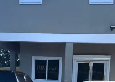 Entrance of The Beauty Boss Bureau in Nassau, New Providence, BS featuring sleek modern design.