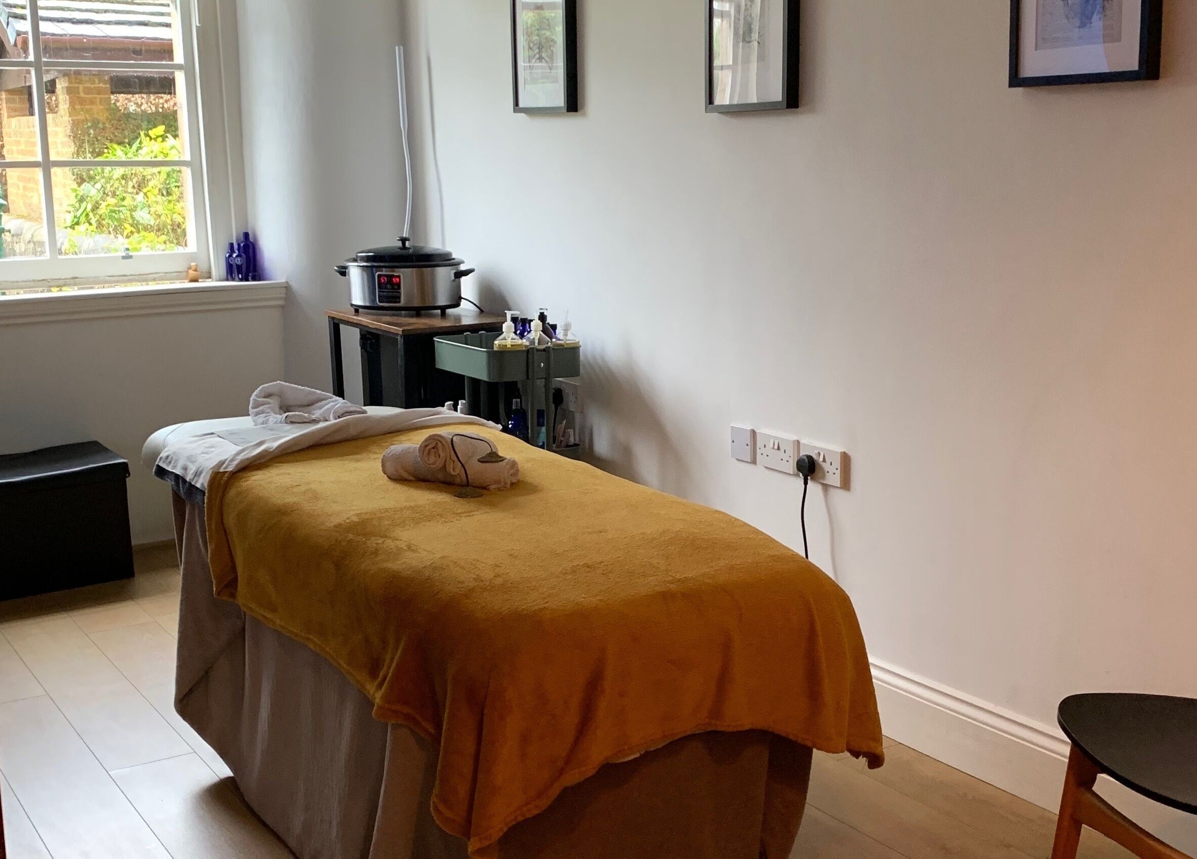 Peaceful therapy room at Sans Peur Therapies in Lenzie, Scotland, GB with massage table and natural light.
