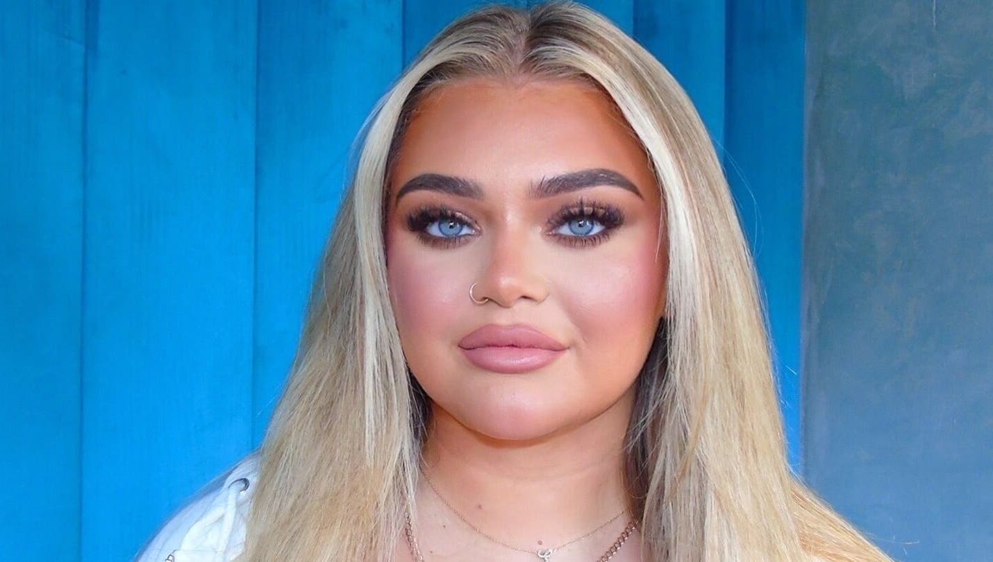 A woman with flawless makeup at Beyond Beauty Training Academy, Glasgow, Scotland, GB.