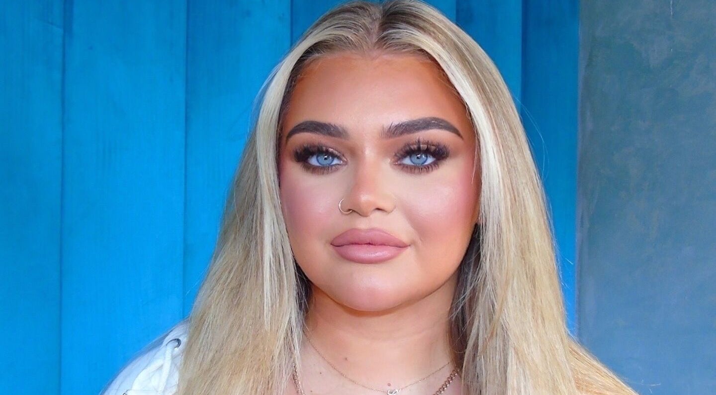 A woman with flawless makeup at Beyond Beauty Training Academy, Glasgow, Scotland, GB.