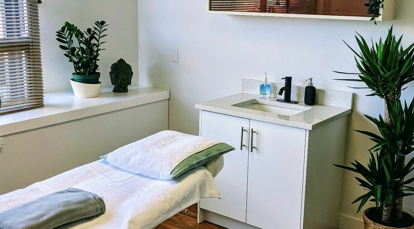 Relaxing spa room at Clarico Electrolysis + Advanced Aesthetics, Vancouver, BC, CA with a cozy treatment bed.