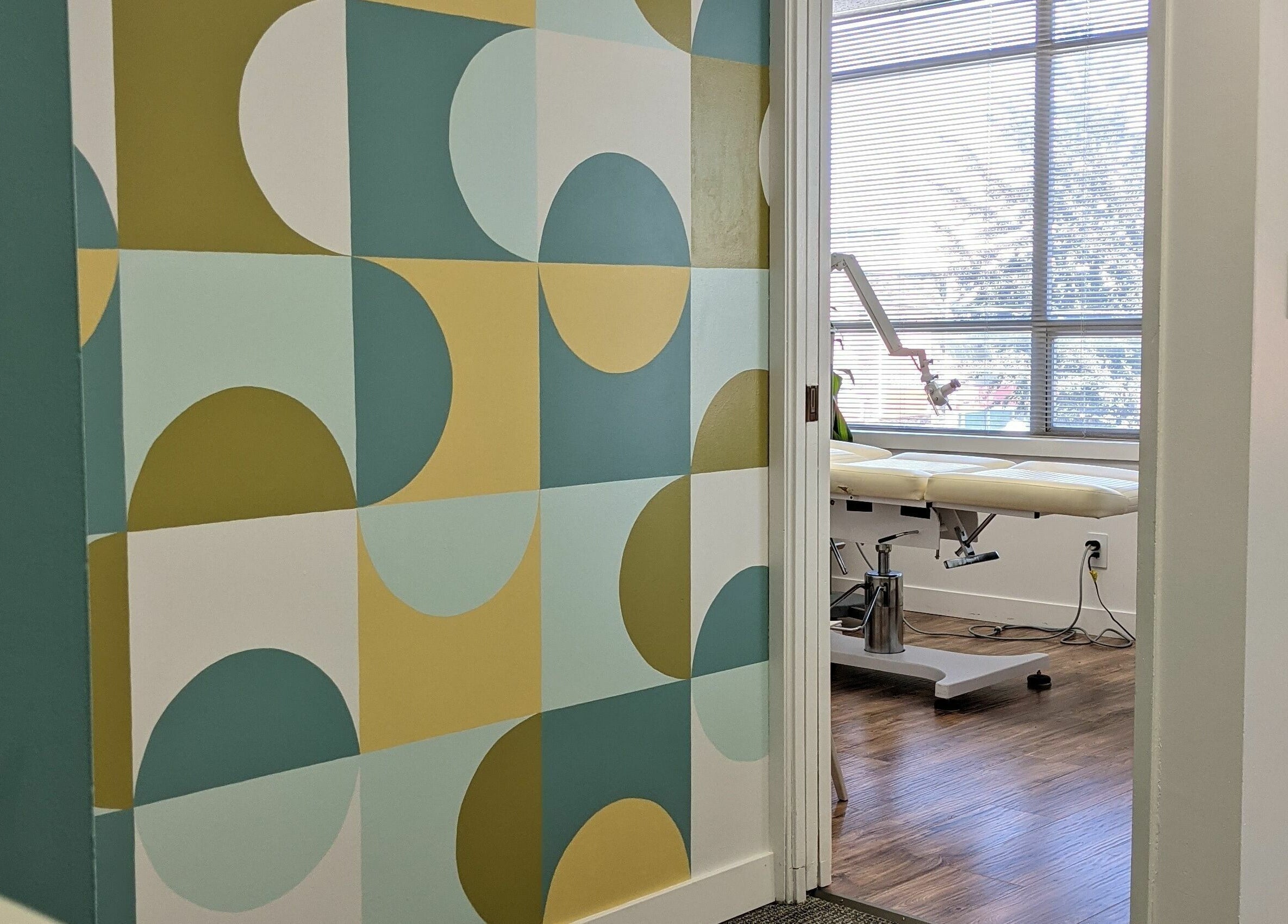Stylish treatment room at Clarico Electrolysis + Advanced Aesthetics, Vancouver, British Columbia, CA with geometric decor.