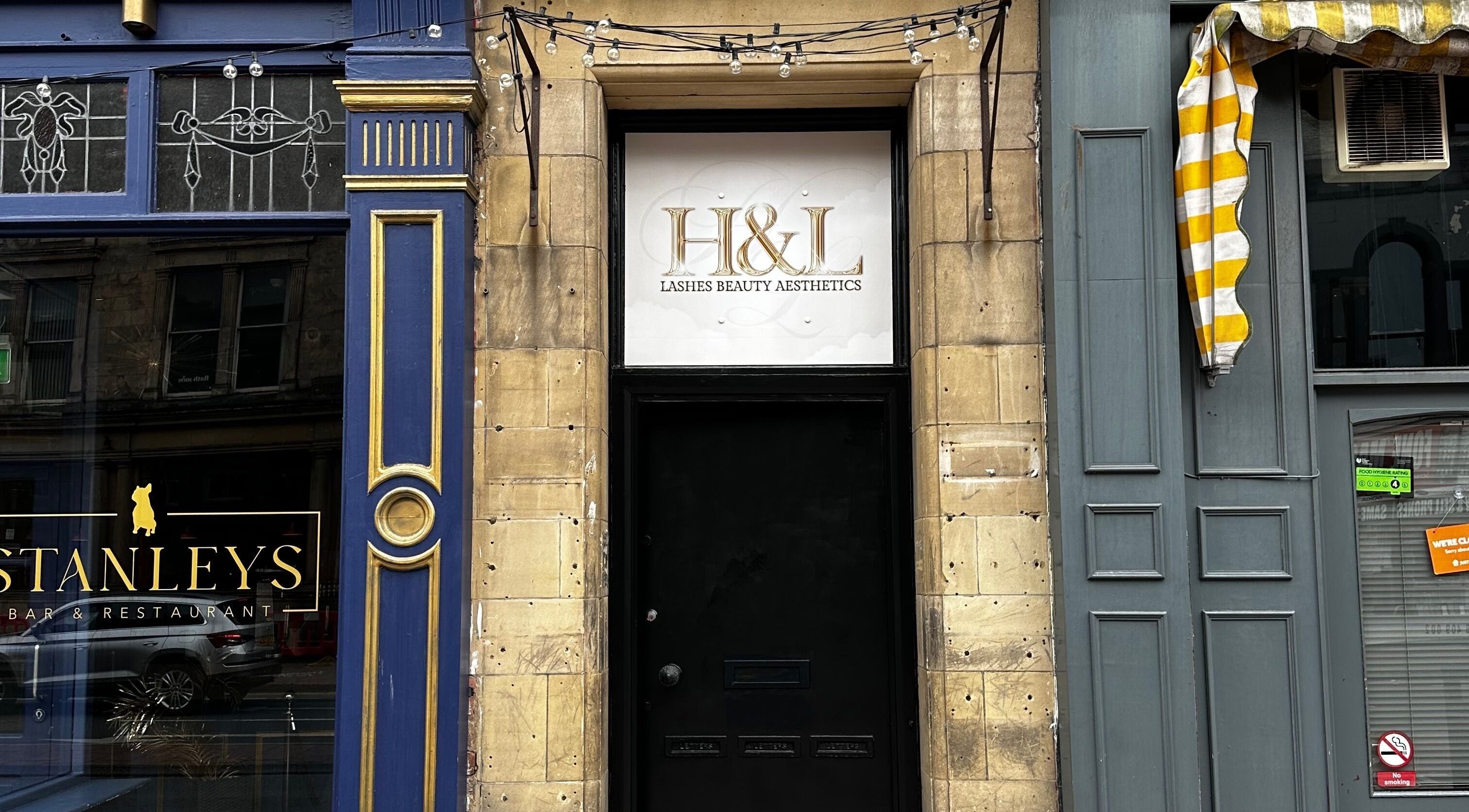 Entrance to H&L Lashes Beauty Aesthetics, Carlisle, England; elegant facade with signage.