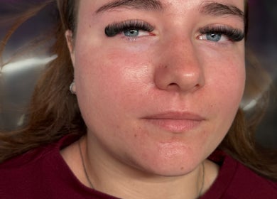 Woman with elegant lashes from H&L Lashes Beauty Aesthetics, Carlisle, England, GB, showcasing natural look.