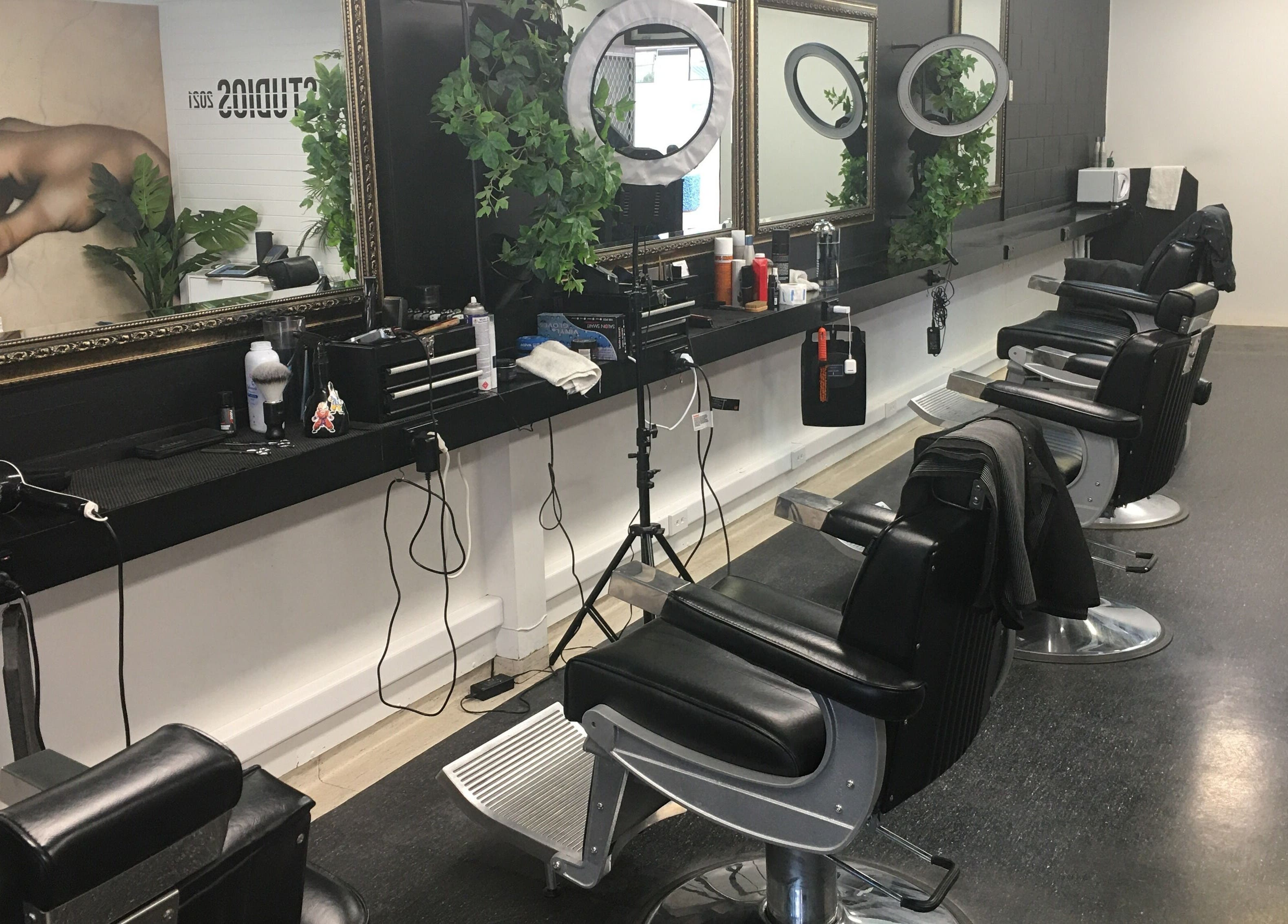 Chic barber chairs and mirrors at Ice Studios, Palmerston North, Manawatu-Wanganui, NZ with elegant decor.