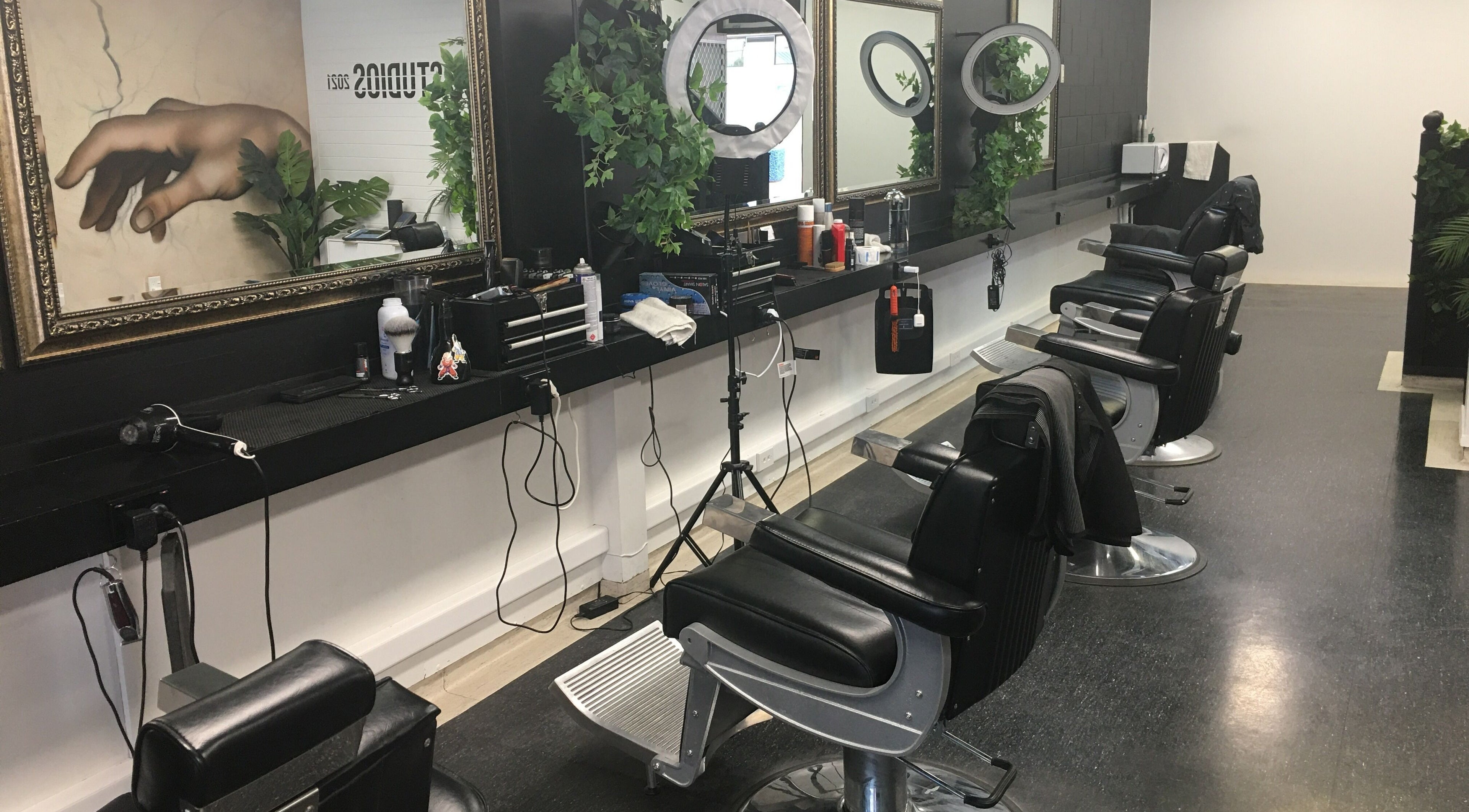 Chic barber chairs and mirrors at Ice Studios, Palmerston North, Manawatu-Wanganui, NZ with elegant decor.