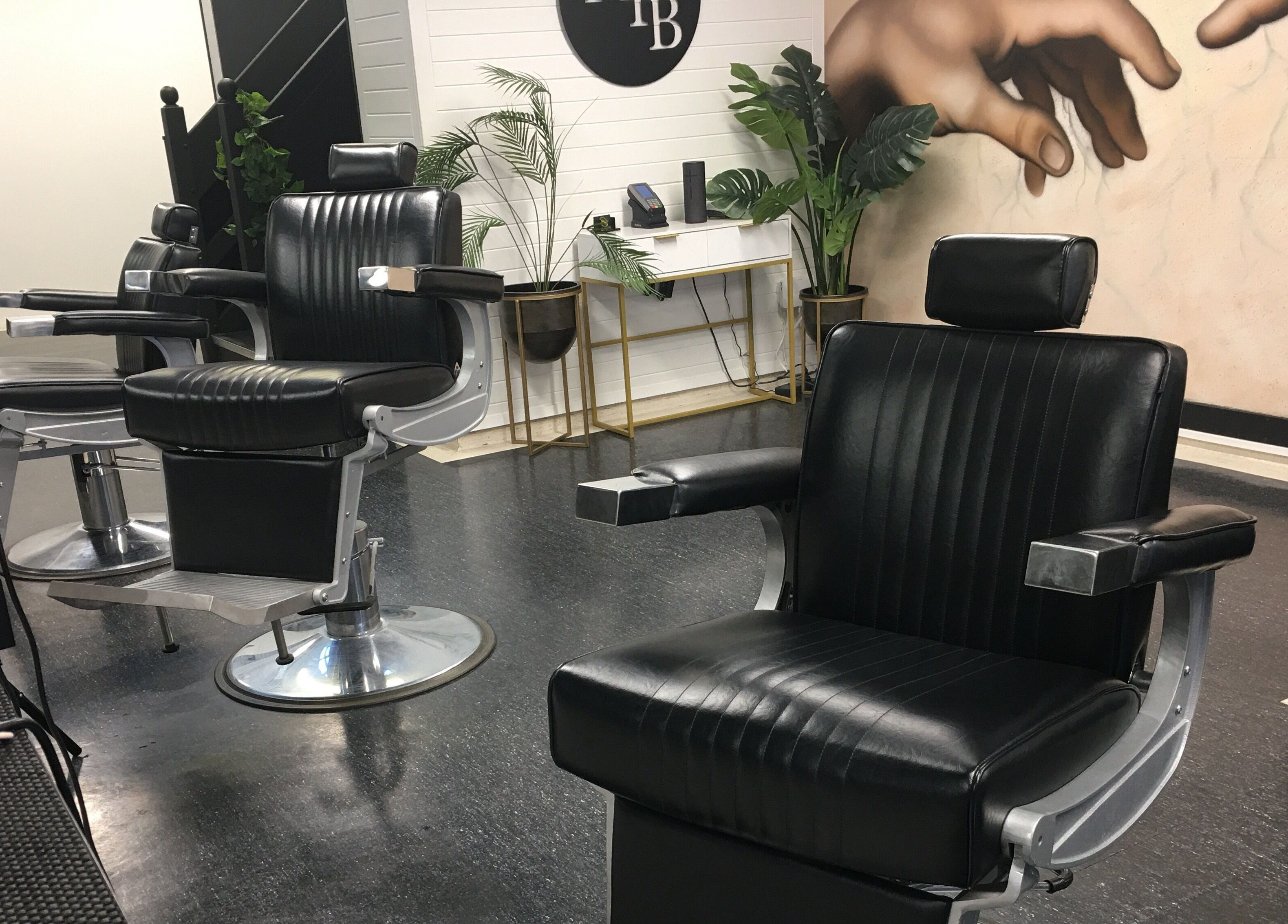 Modern barber chairs at Ice Studios in Palmerston North, Manawatu-Wanganui, NZ. Sleek and stylish interior.