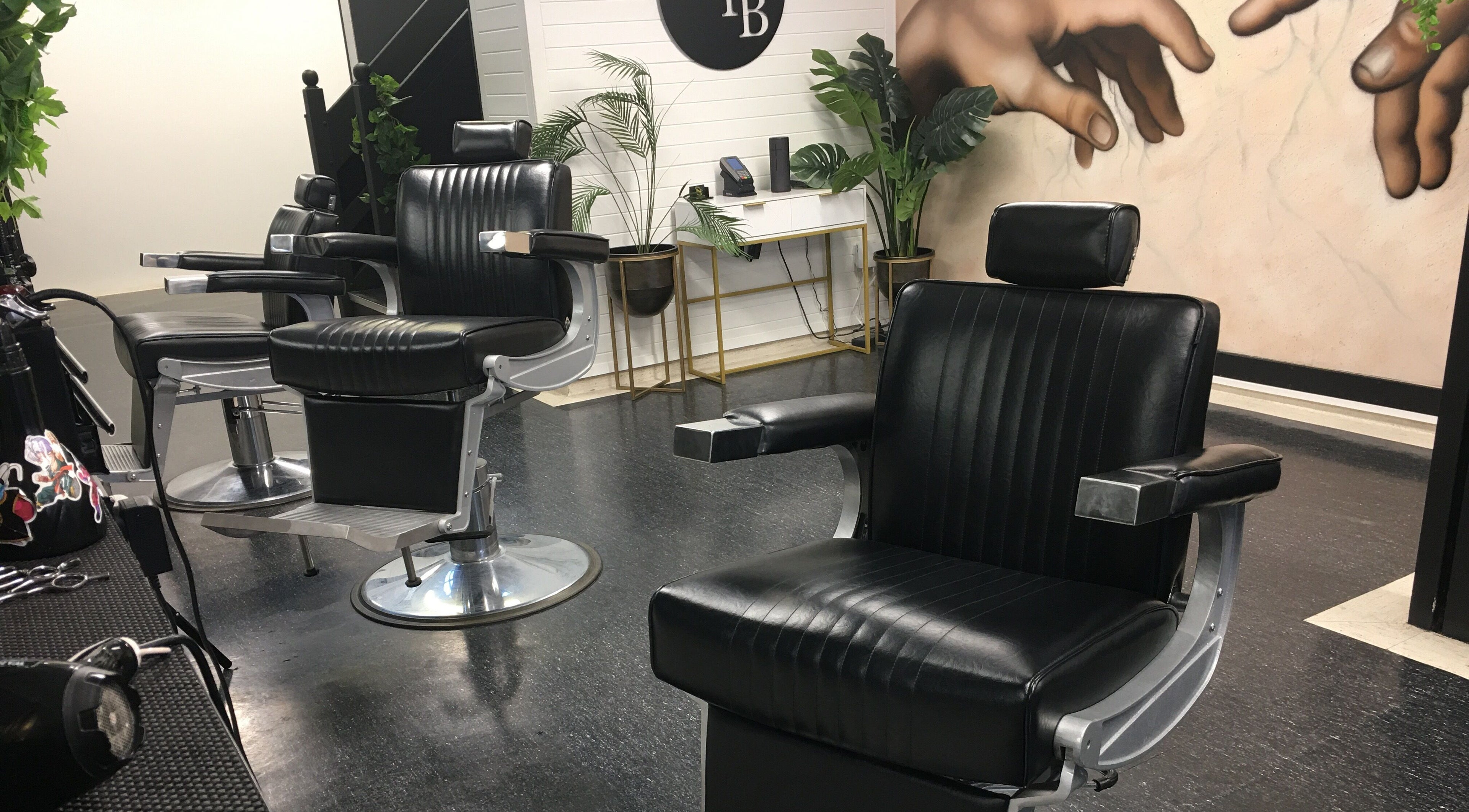 Modern barber chairs at Ice Studios in Palmerston North, Manawatu-Wanganui, NZ. Sleek and stylish interior.