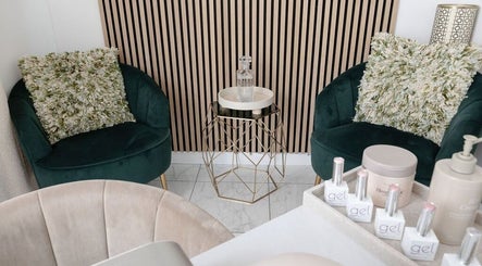 Chic seating area at The Beauty Shack, Failand, England, GB featuring plush chairs and a stylish table.