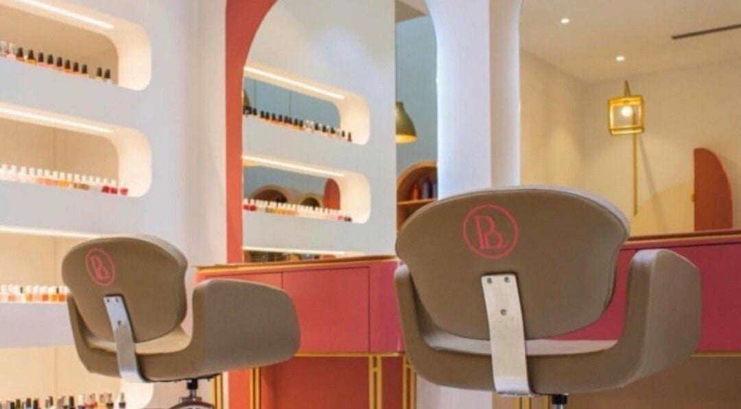Elegant nail bar at La Casa Beauty Salon in Riffa, BH, featuring sleek design and vibrant nail polish selection.