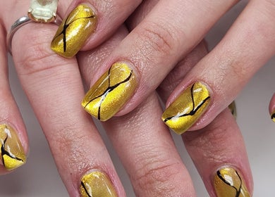 Elegant gold nail art at Royal Nails & Beauty Kelston, Auckland, Auckland, NZ, showcasing intricate designs.